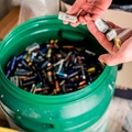 Batteries being disposed of in recycling center.