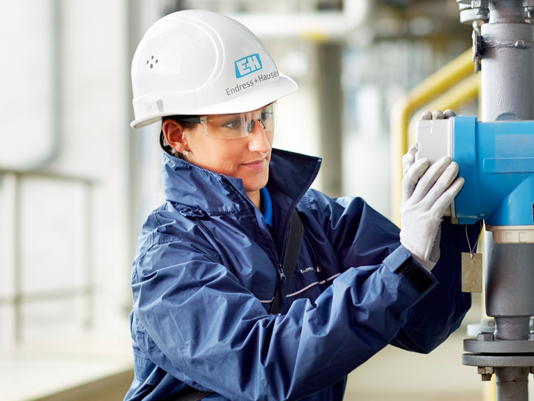 Coriolis from Endress+hauser at a customer's plant Picture of Endress+Hauser employee installing a Coriolis at a customer's plant