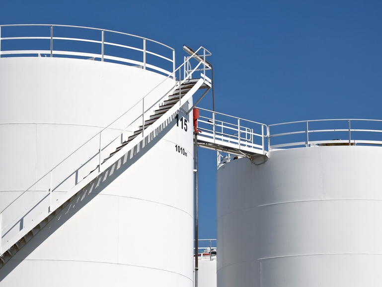 Replace the floats in your oil tanks with vibronic limit switches Picture of an array of storage tanks in a refinery
