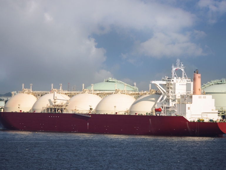 LNG tanker docked at a terminal LNG tanker loading at a terminal